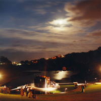 Colour photograph of Pan Pan Theatre Company's CITY venue, designed by Andrew Clancey, at night in Blackrock Park.