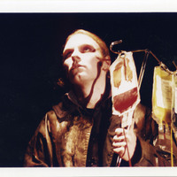 Colour photograph of Mark McCaffrey as 'No.252' in Tailors Requiem by Pan Pan Theatre Company