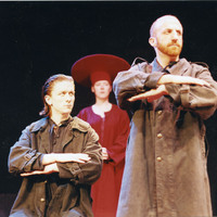 Colour photograph of Tony Flynn and Charles Kelly in front of Mary o'Driscoll in Madamoiselle Flic Flac in the Red Room by Pan Pan Theatre Company