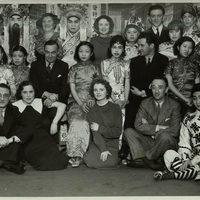 Black and white photograph of Arthur Shields, Aideen O'Connor, Denis O'Dea and a number of other Abbey cast members with a number of Chinese men and women in traditional clothes.