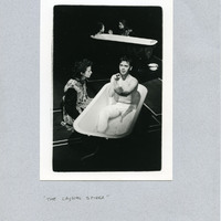 A black-and-white photograph glued onto grey cardboard, depicting Carmel Flanaghan and Senan Dunne in Pan Pan Theatre Company's The Crystal Spider
