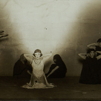 Black and white photograph of several dancers on stage.