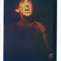 Colour photograph of a performance of A Bronze Twist of your Serpent Muscles by Pan Pan Theatre Company