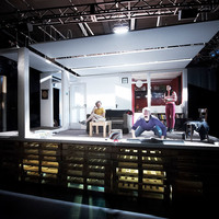 Colour photograph of the stage and set, including the cast, of Everyone is King Lear in His Own Home by Pan Pan Theatre Company. Photo by Ros Kavanagh.