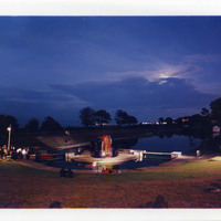 Colour photograph of Pan Pan Theatre Company's CITY venue, designed by Andrew Clancey, at night in Blackrock Park.